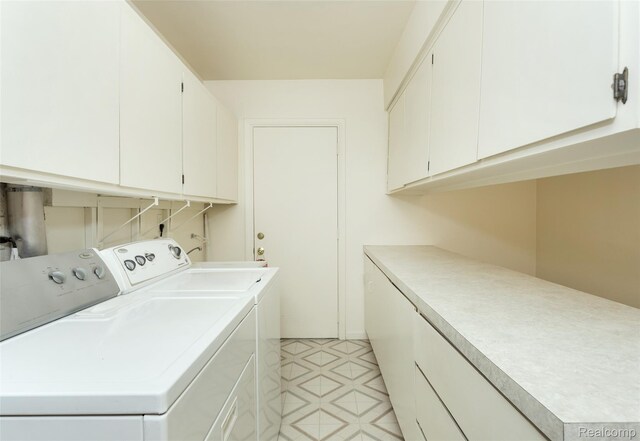 2982 Shawnee Ln, Waterford, MI 48329 - laundry area with separate washer and dryer and cabinet space
