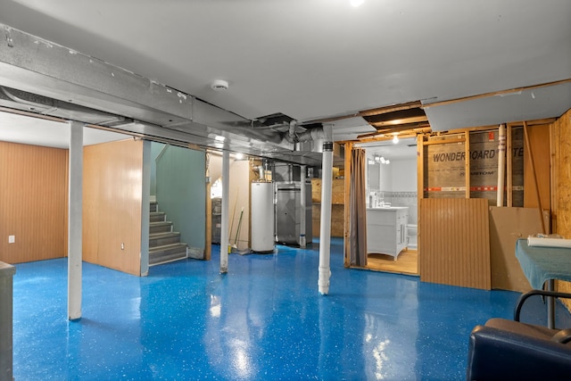 unfinished below grade area featuring water heater and stairs