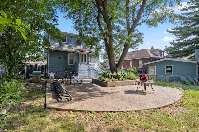 back of house with fence and a patio