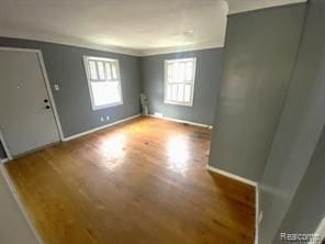 20200 Roselawn St, Detroit, MI 48221 - spare room with wood finished floors and baseboards