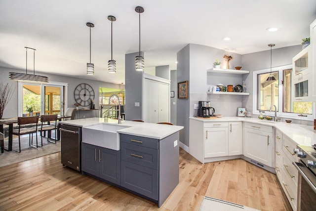 8440 Lance, Brighton, MI 48116 - kitchen featuring dishwashing machine, a sink, stainless steel electric range oven, light wood-type flooring, and recessed lighting