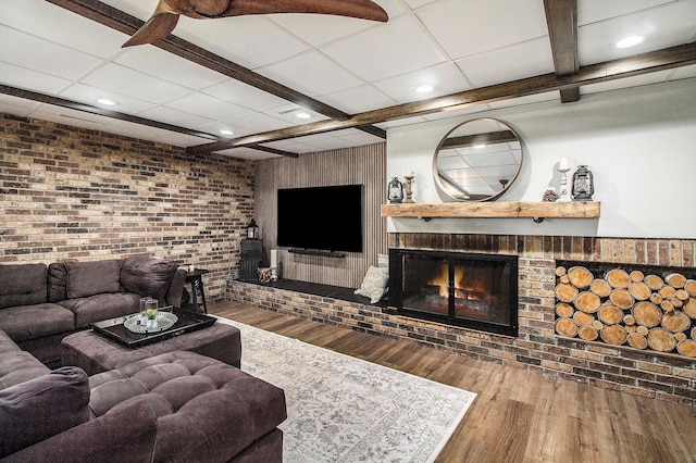 8440 Lance, Brighton, MI 48116 - living room with wood finished floors, a brick fireplace, recessed lighting, and brick wall