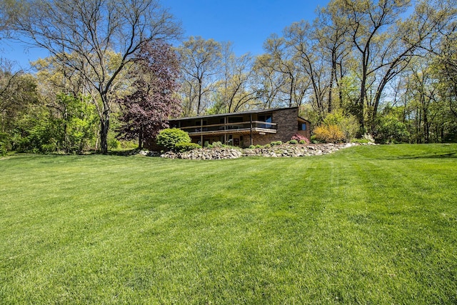 8440 Lance, Brighton, MI 48116 - view of grassy yard with a wooden deck