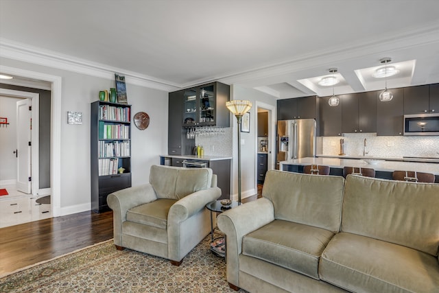 15 E Kirby St Unit 822, Detroit, MI 48202 - living area featuring bar, wood finished floors, ornamental molding, and baseboards