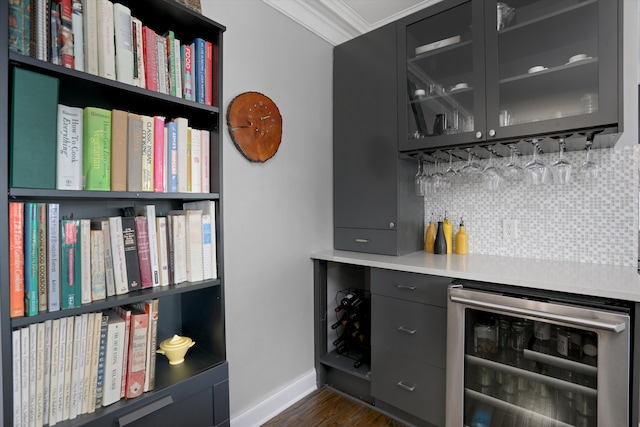 15 E Kirby St Unit 822, Detroit, MI 48202 - indoor dry bar with wine cooler, baseboards, tasteful backsplash, dark wood-type flooring, and ornamental molding