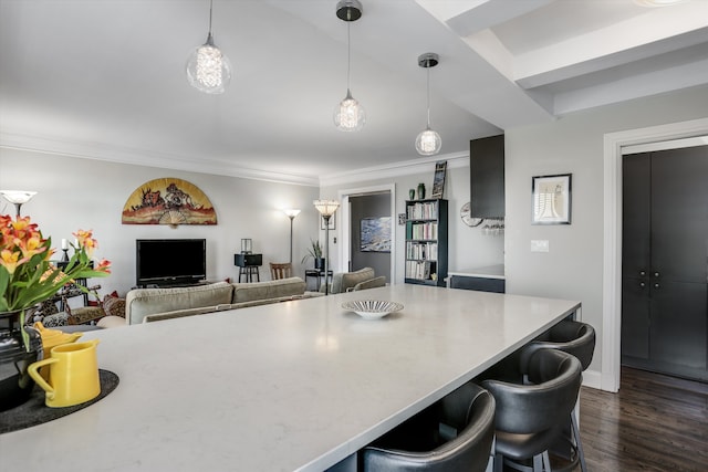 15 E Kirby St Unit 822, Detroit, MI 48202 - kitchen featuring a breakfast bar area, dark wood-style flooring, pendant lighting, crown molding, and light countertops