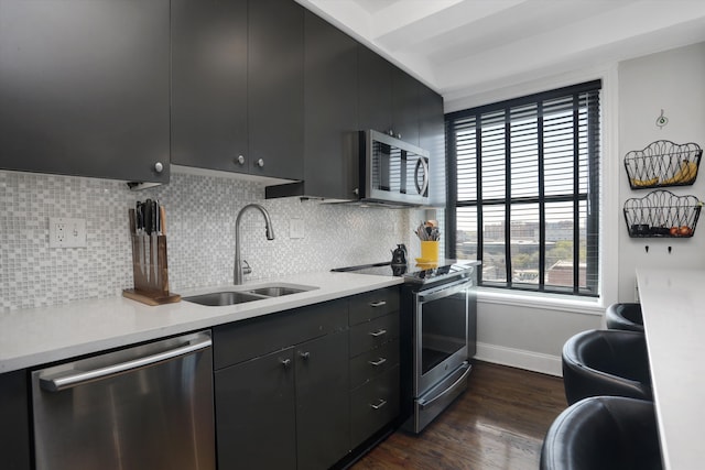 15 E Kirby St Unit 822, Detroit, MI 48202 - kitchen featuring appliances with stainless steel finishes, a sink, dark cabinets, and light countertops