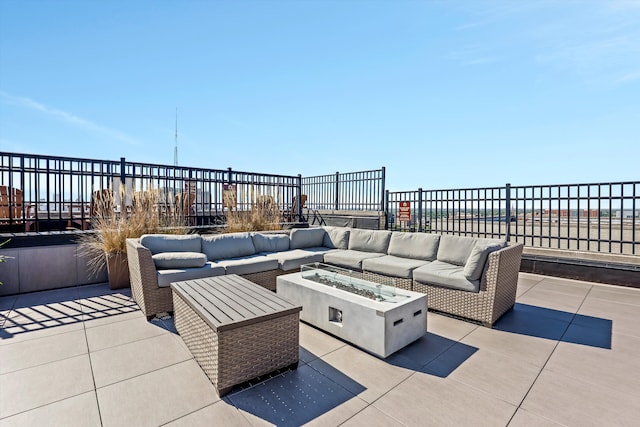 15 E Kirby St Unit 822, Detroit, MI 48202 - view of patio featuring an outdoor living space with a fire pit and fence