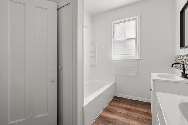 5370 Seebaldt St, Detroit, MI 48204 - bathroom with baseboards, vanity, and wood finished floors