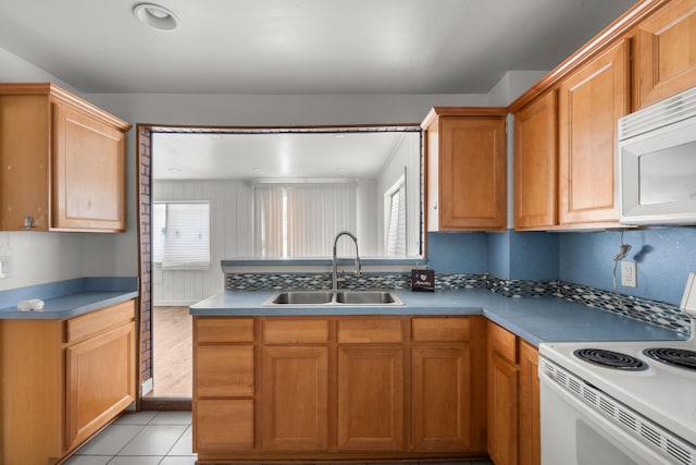 5370 Seebaldt St, Detroit, MI 48204 - kitchen with white appliances, a sink, healthy amount of natural light, and light tile patterned flooring