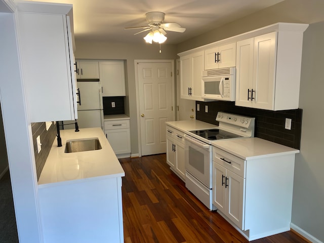 kitchen featuring white appliances, a sink, decorative backsplash, dark wood-style floors, and a ceiling fan