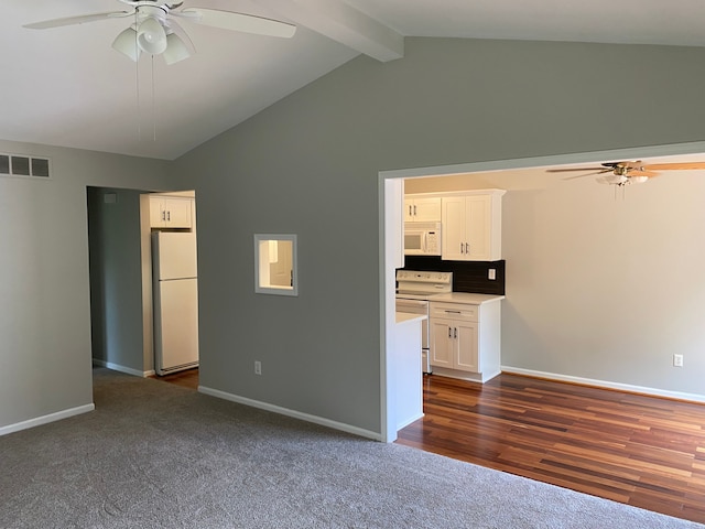 unfurnished living room with ceiling fan, dark colored carpet, beamed ceiling, baseboards, and high vaulted ceiling