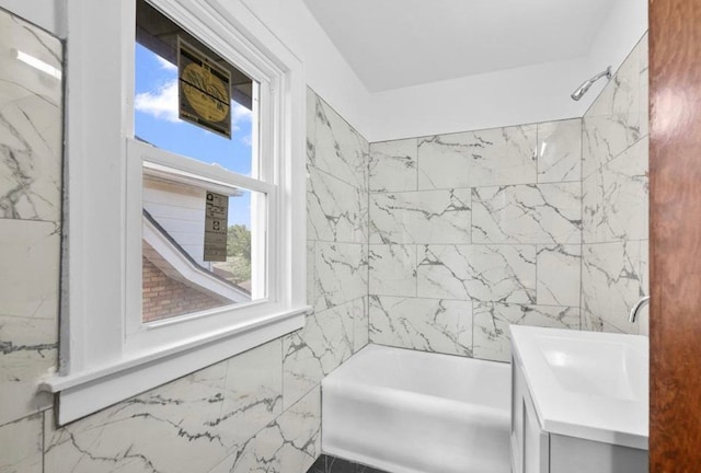 7305 Appoline St, Dearborn, MI 48126 - bathroom featuring plenty of natural light, tile walls, bathtub / shower combination, and vanity