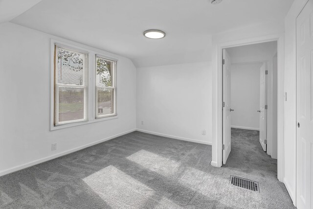 15053 Dumay St, Southgate, MI 48195 - unfurnished bedroom featuring carpet floors, lofted ceiling, and baseboards