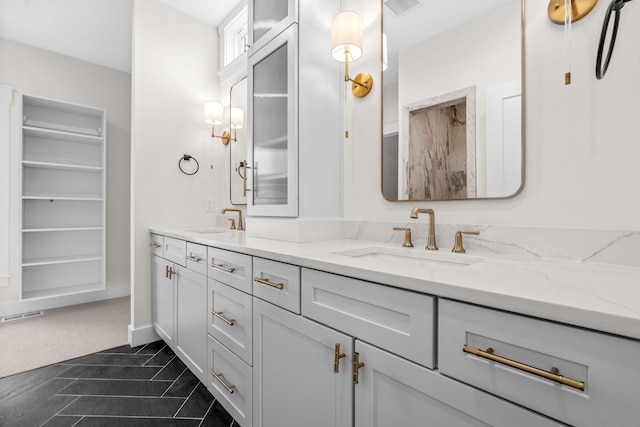 full bath featuring double vanity and a spacious closet