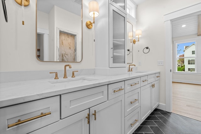 full bath with double vanity, recessed lighting, baseboards, and tile patterned flooring