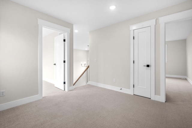 unfurnished room with carpet, recessed lighting, and baseboards