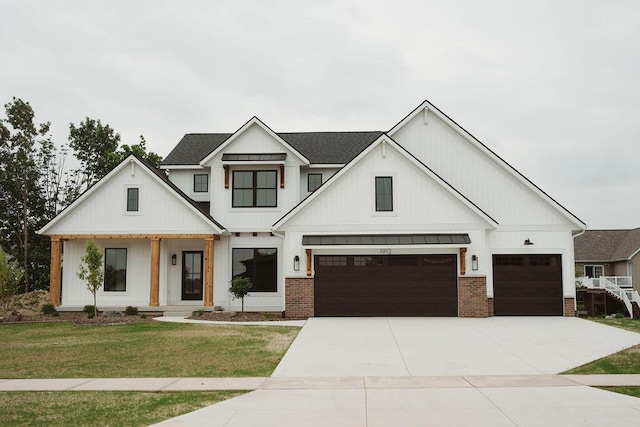 1912 Creekside Dr SW, Byron Center, MI 49315 - modern inspired farmhouse featuring a front yard, a standing seam roof, concrete driveway, a metal roof, and a shingled roof