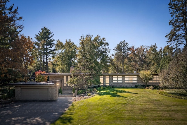 5280 Brookdale Rd, Bloomfield Hills, MI 48304 - view of front of house featuring a front yard, a garage, and a chimney