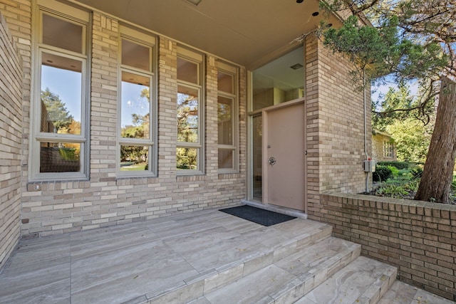 5280 Brookdale Rd, Bloomfield Hills, MI 48304 - doorway to property featuring brick siding and a porch