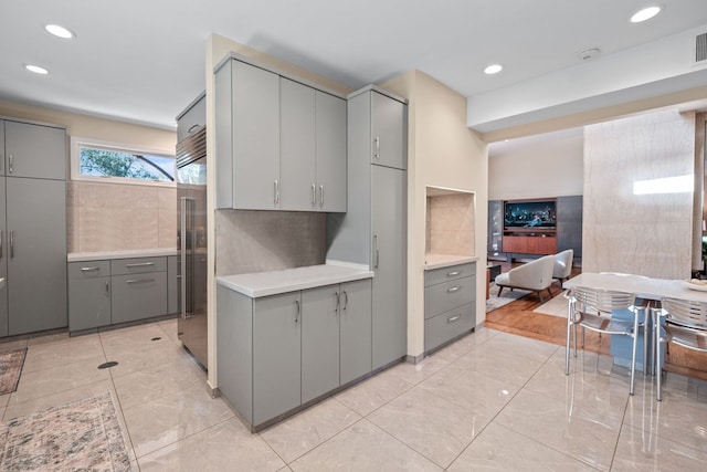 5280 Brookdale Rd, Bloomfield Hills, MI 48304 - kitchen with gray cabinets, light countertops, recessed lighting, and built in refrigerator