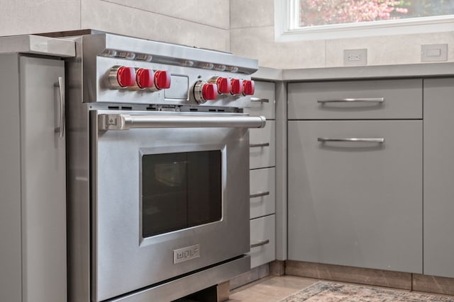 5280 Brookdale Rd, Bloomfield Hills, MI 48304 - kitchen view of luxury range and gray cabinets