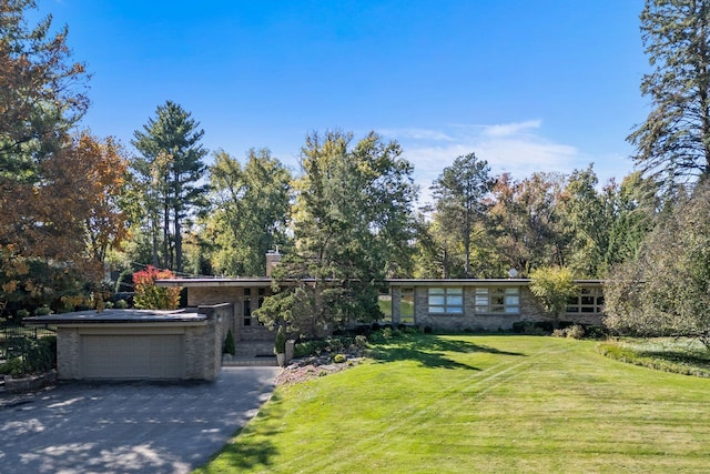5280 Brookdale Rd, Bloomfield Hills, MI 48304 - mid-century inspired home featuring a front lawn, a garage, a chimney, and brick siding