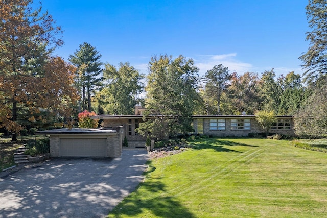 5280 Brookdale Rd, Bloomfield Hills, MI 48304 - mid-century inspired home featuring asphalt driveway, a front yard, a chimney, and a garage