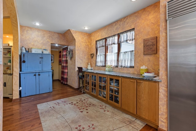 939 S Highland St, Dearborn, MI 48124 - bar area with stainless steel built in refrigerator, wood finished floors, baseboards, and recessed lighting