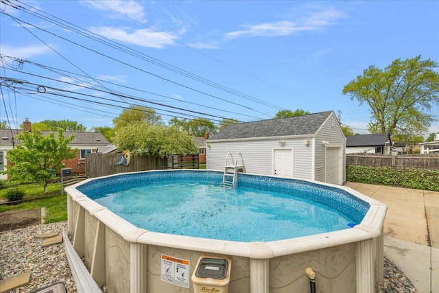 23142 Port St, Saint Clair Shores, MI 48082 - view of pool featuring fence and an outbuilding