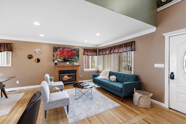 23142 Port St, Saint Clair Shores, MI 48082 - living area featuring baseboards, a glass covered fireplace, recessed lighting, and wood finished floors