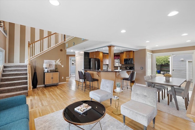 23142 Port St, Saint Clair Shores, MI 48082 - living room with stairway, baseboards, recessed lighting, and light wood-type flooring