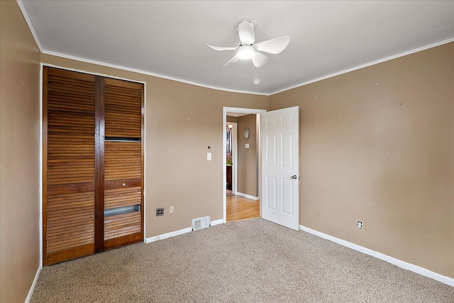 23142 Port St, Saint Clair Shores, MI 48082 - unfurnished bedroom featuring carpet, baseboards, a closet, ornamental molding, and a ceiling fan
