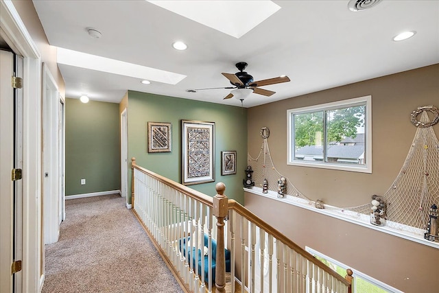23142 Port St, Saint Clair Shores, MI 48082 - corridor with a skylight, carpet, recessed lighting, baseboards, and an upstairs landing
