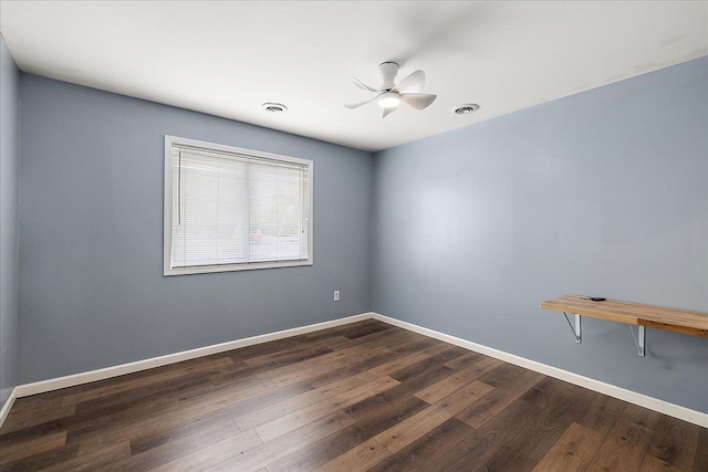 23142 Port St, Saint Clair Shores, MI 48082 - unfurnished room with dark wood-style floors, baseboards, and a ceiling fan