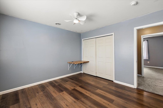 23142 Port St, Saint Clair Shores, MI 48082 - unfurnished bedroom with baseboards, a closet, dark wood finished floors, and ceiling fan