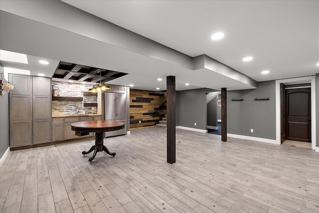 23142 Port St, Saint Clair Shores, MI 48082 - finished below grade area with high end fridge, baseboards, light wood-style floors, recessed lighting, and wooden walls
