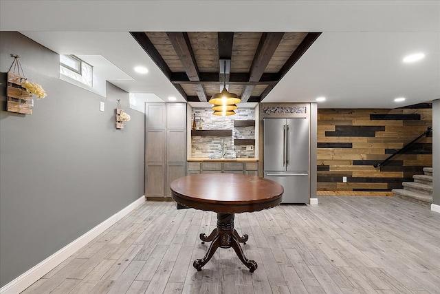 23142 Port St, Saint Clair Shores, MI 48082 - bar area with high end refrigerator, light wood-style floors, stairs, wooden ceiling, and baseboards