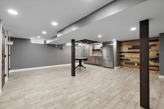 23142 Port St, Saint Clair Shores, MI 48082 - finished basement with stainless steel built in refrigerator, light wood finished floors, stairway, baseboards, and recessed lighting