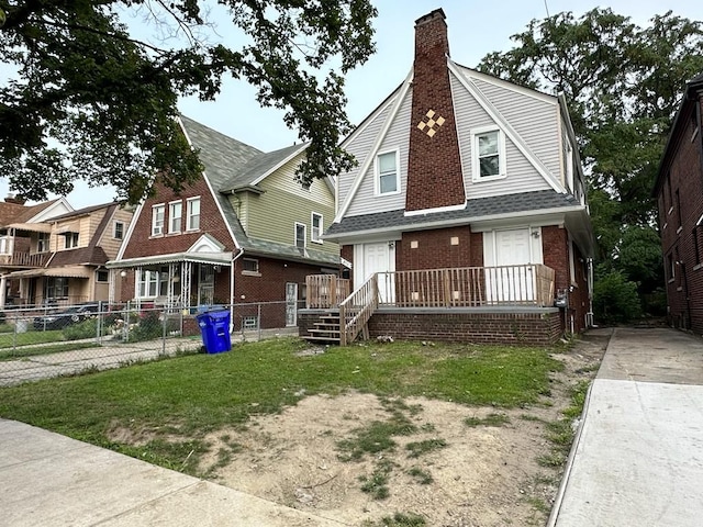2711 Burlingame St, Detroit, MI 48206 - view of front of house with brick siding, a chimney, fence, and roof with shingles
