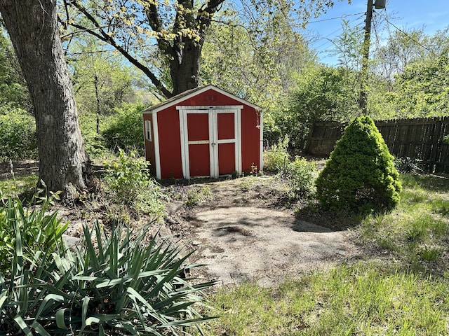 view of shed with fence