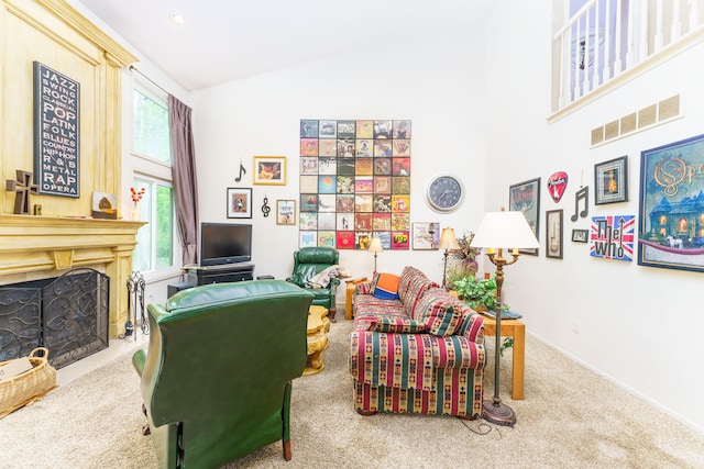 1418 Trailside Blvd, Wixom, MI 48393 - carpeted living area with high vaulted ceiling, a fireplace, and baseboards