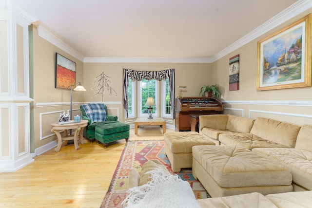 1418 Trailside Blvd, Wixom, MI 48393 - living room with ornamental molding, light wood finished floors, a decorative wall, and a wainscoted wall