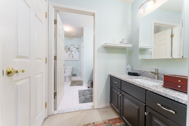 1418 Trailside Blvd, Wixom, MI 48393 - bathroom with toilet, vanity, tile patterned floors, and baseboards