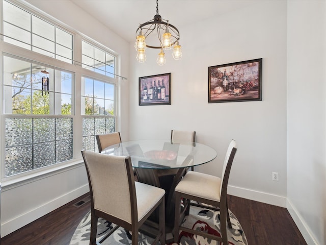 230 Atlantis Cir, Oxford, MI 48371 - dining area with baseboards, dark wood-style flooring, and a chandelier