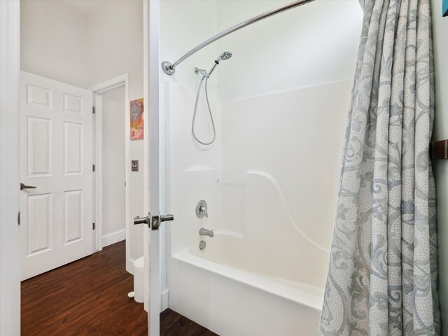 230 Atlantis Cir, Oxford, MI 48371 - full bath with wood finished floors, shower / tub combo with curtain, and baseboards