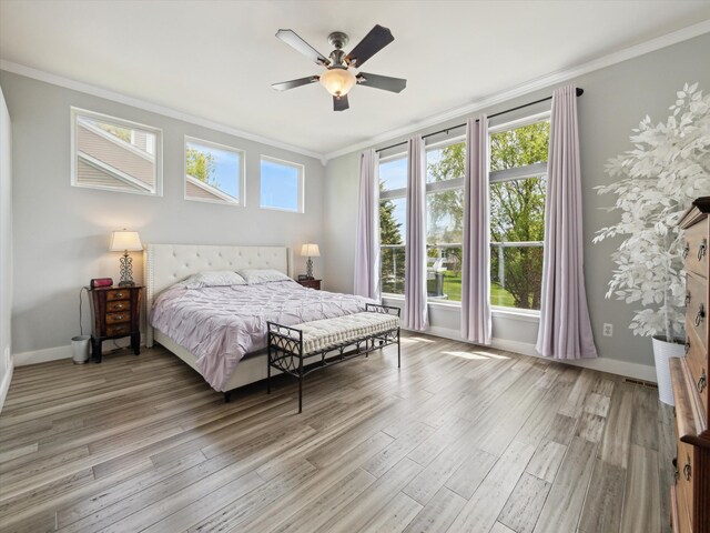 230 Atlantis Cir, Oxford, MI 48371 - bedroom featuring crown molding, light wood-type flooring, baseboards, and ceiling fan