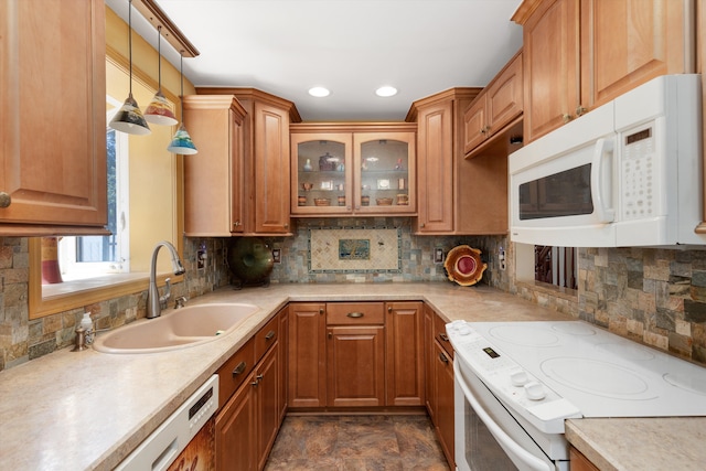 19985 Charest St, Detroit, MI 48234 - kitchen with white appliances, a sink, decorative backsplash, light countertops, and pendant lighting