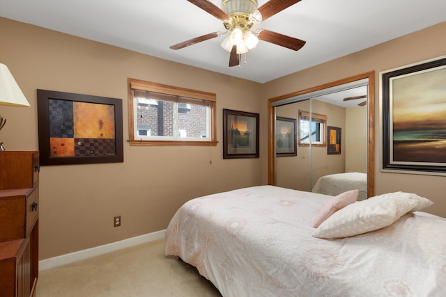19985 Charest St, Detroit, MI 48234 - bedroom with light colored carpet, a closet, a ceiling fan, and baseboards