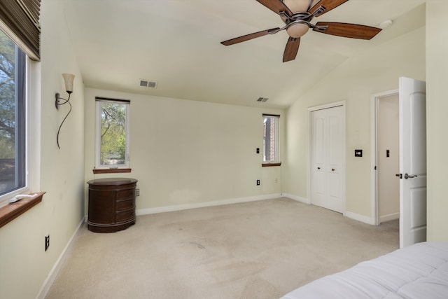 19985 Charest St, Detroit, MI 48234 - unfurnished bedroom featuring vaulted ceiling, carpet flooring, baseboards, a ceiling fan, and a closet